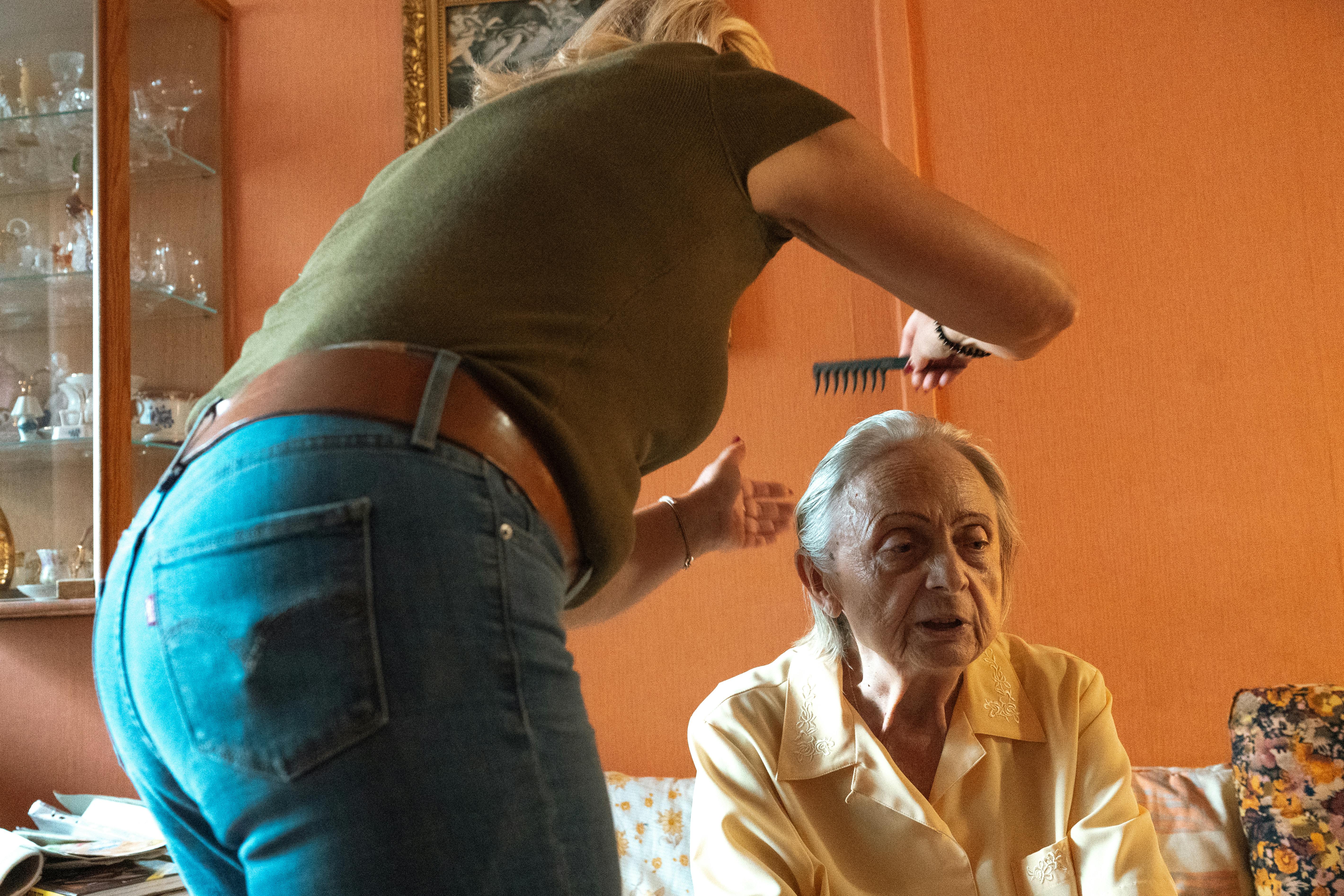 Elderly man warmly greeting at his home