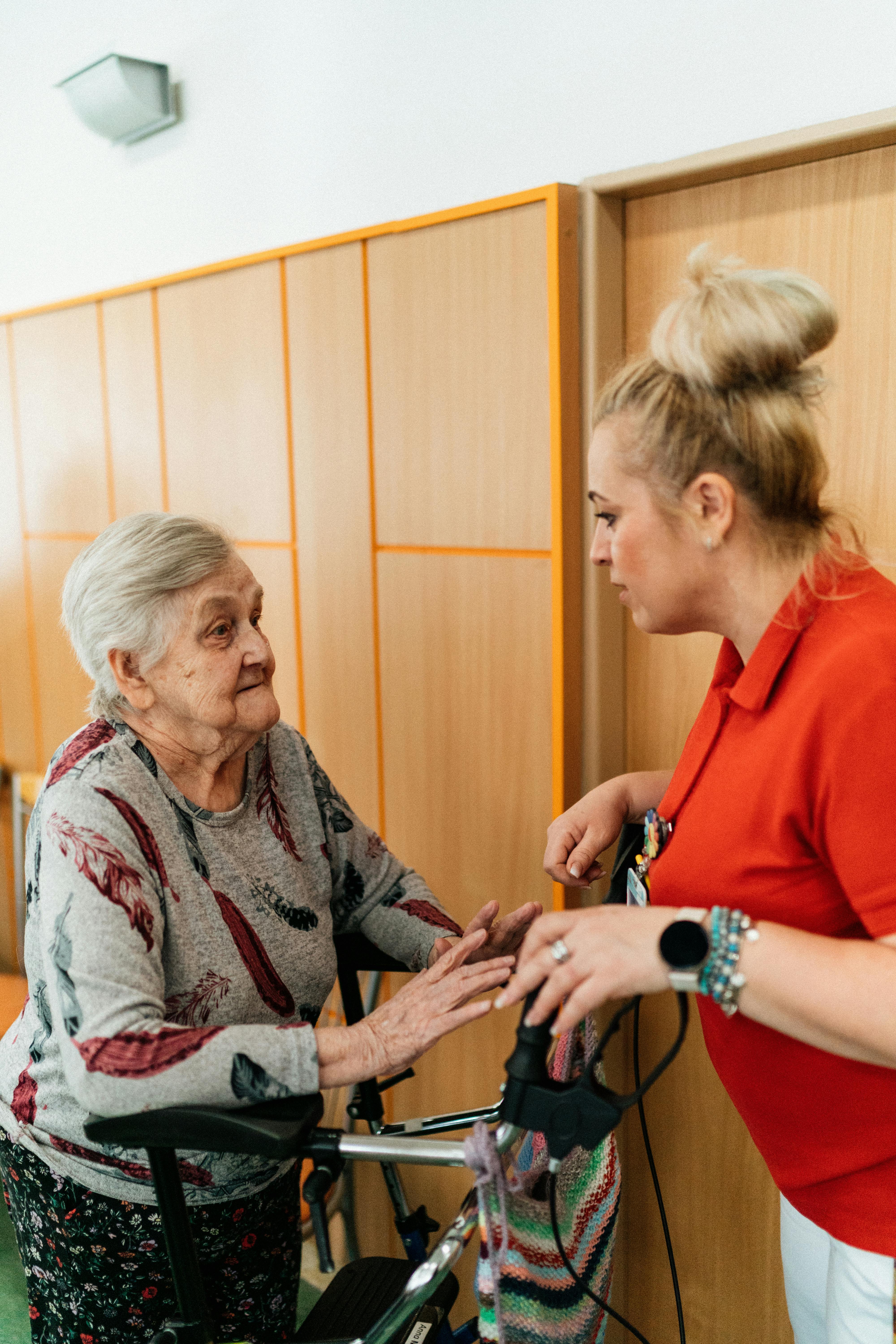Healthcare professional checking in on a patient's recovery